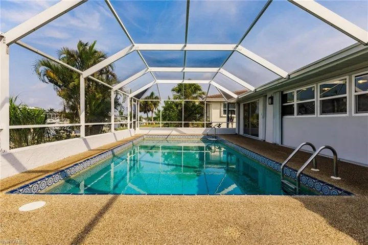 View of pool featuring a lanai