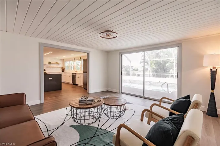 Living room featuring wooden ceiling and hardwood / wood-style flooring