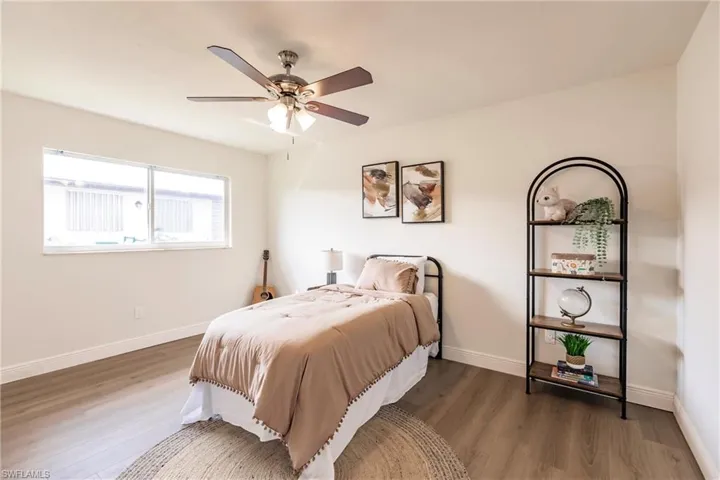 Bedroom featuring hardwood / wood-style floors and ceiling fan