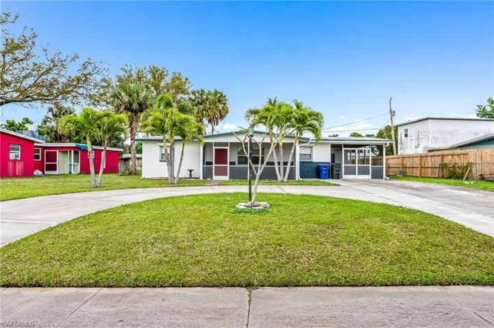 Front of home with large circle drivway