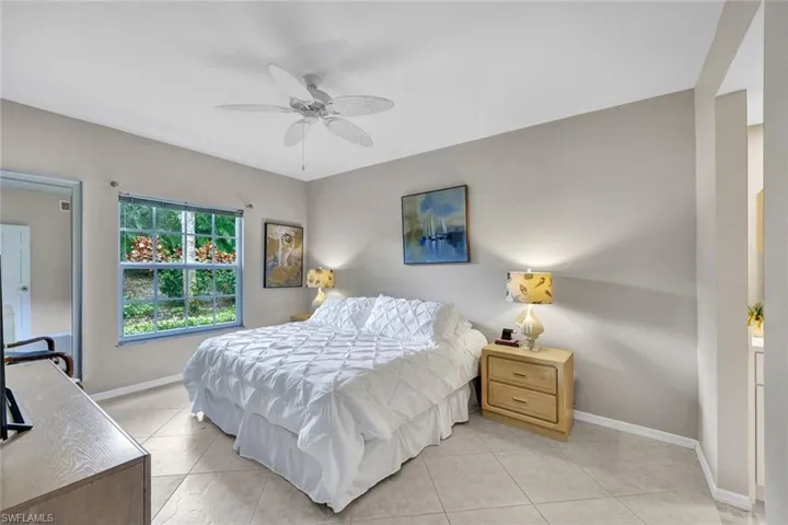 Tiled bedroom with ceiling fan