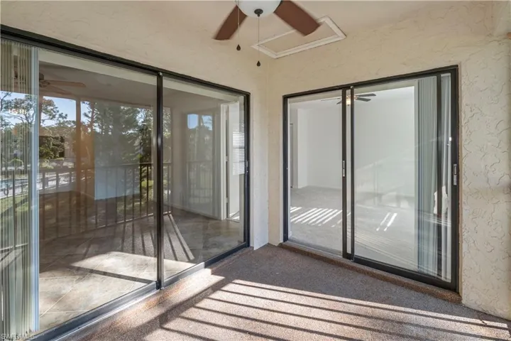 Unfurnished sunroom featuring a textured wall