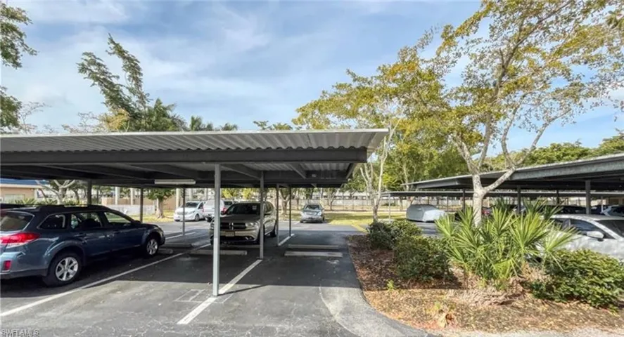 Assigned parking space with carport.