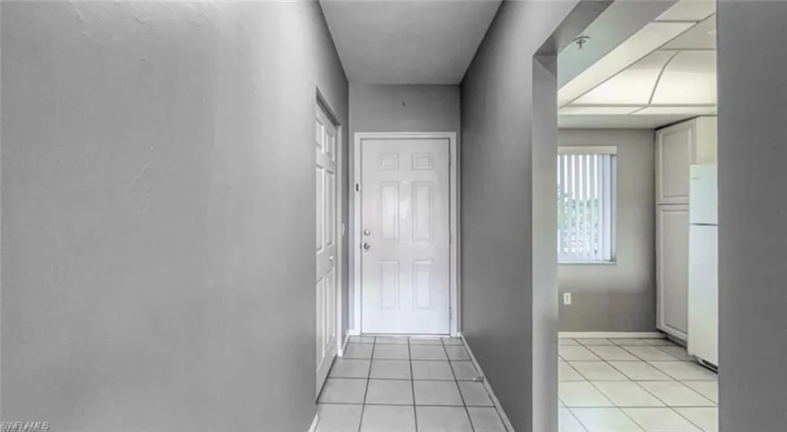 Entryway featuring light tile floor
