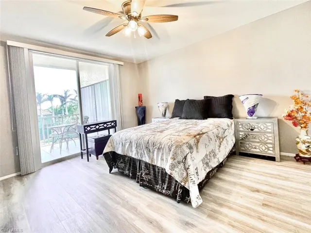 Bedroom with lanai access and lots of natural light.