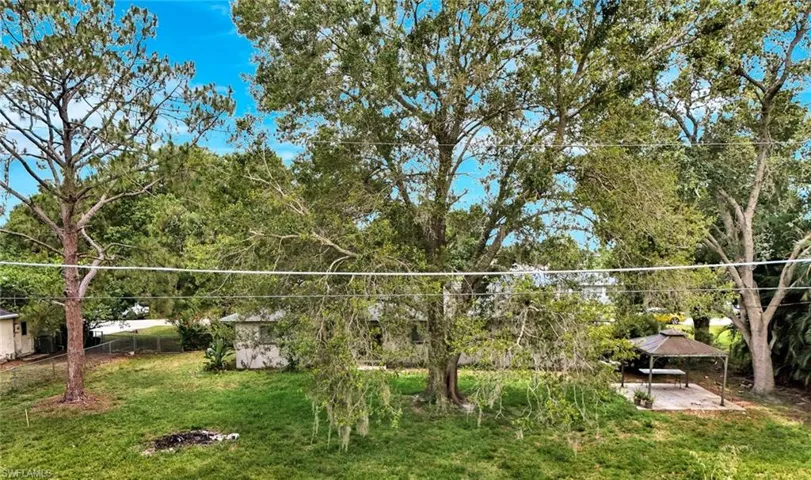View of green lawn featuring a gazebo