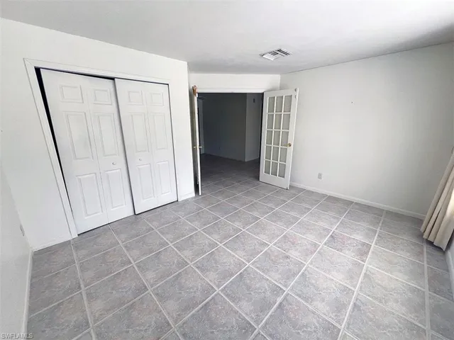 Unfurnished bedroom featuring a closet
