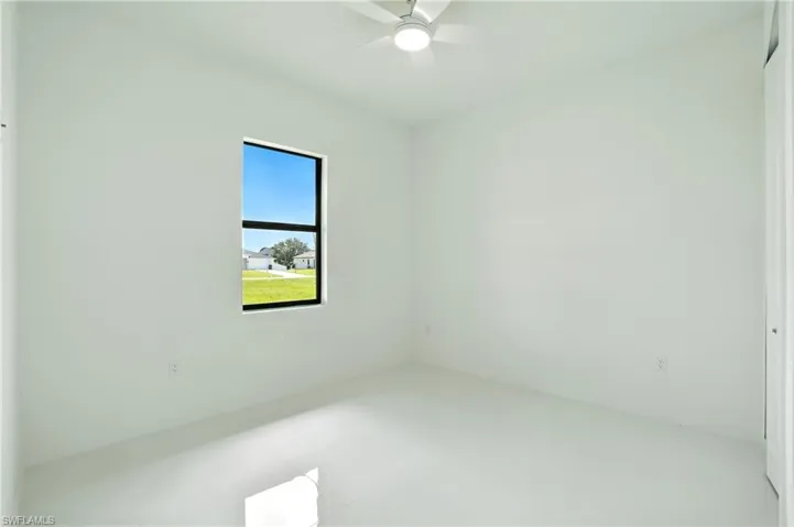 Spare room with a ceiling fan