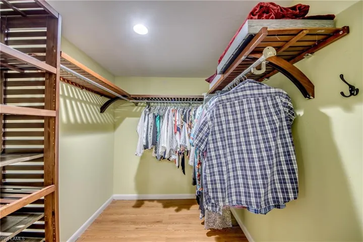 Walk in closet featuring light wood-style flooring