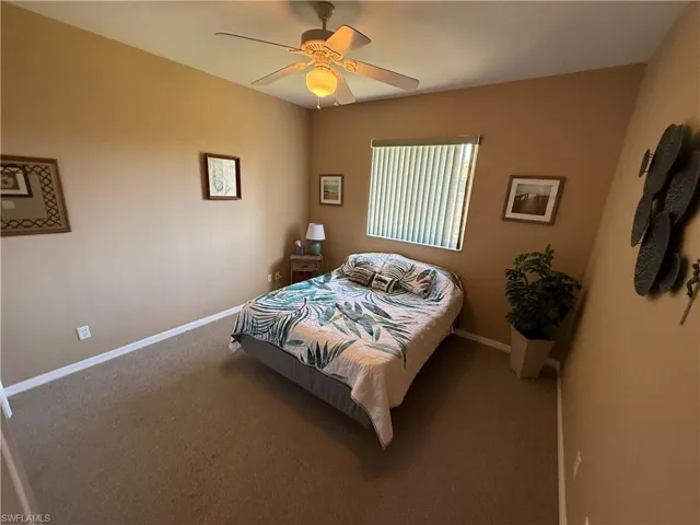 Bedroom featuring carpet flooring and a ceiling fan