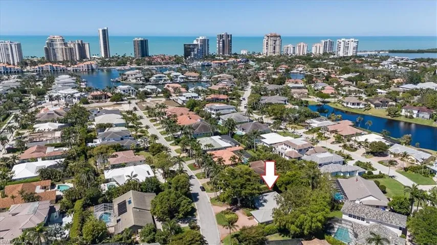 Aerial view featuring a view of city and a water view