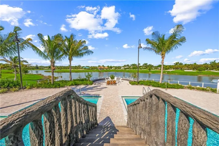 View of pool featuring a water view and a patio area