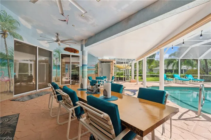 Lanai with painted murals for a Southwest Florida Vibe
