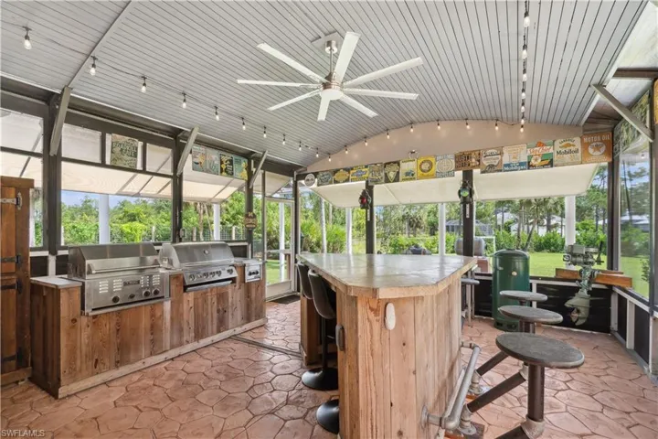 Man Cave with commercial kitchen and grills plus a fun bar