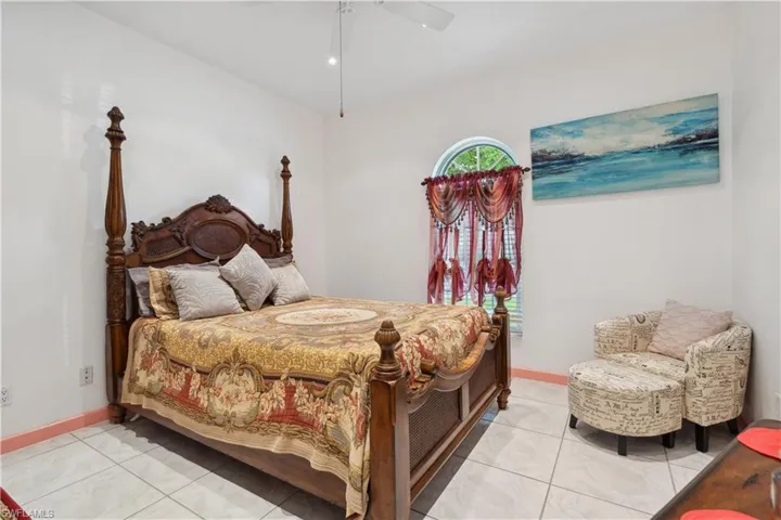 Guest bedroom with tile floors