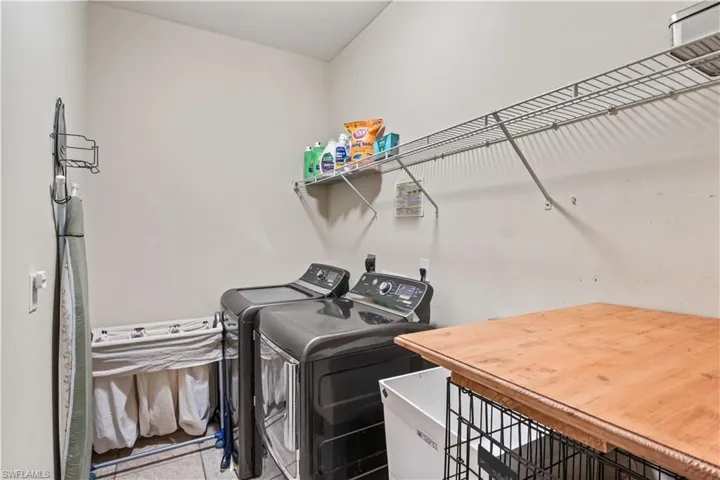 Laundry area with washing machine and clothes dryer
