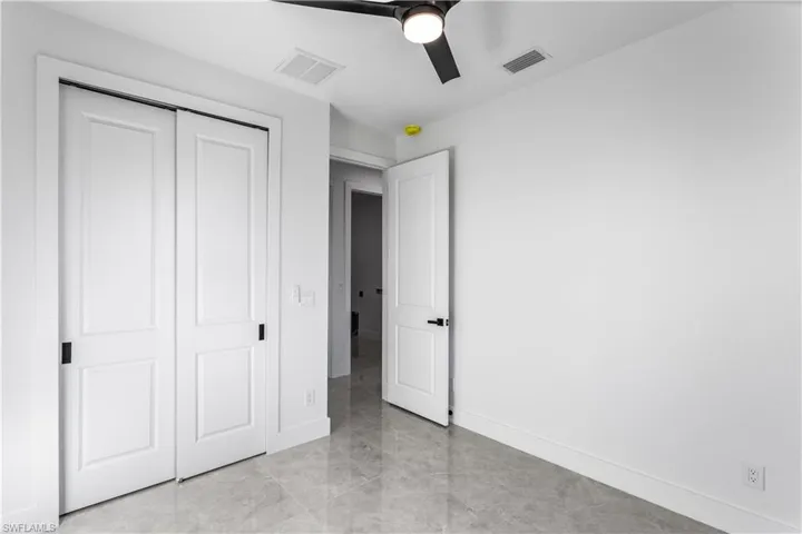 A split floor plan provides privacy for guests, with a hallway bath that also serves as a pool bath.