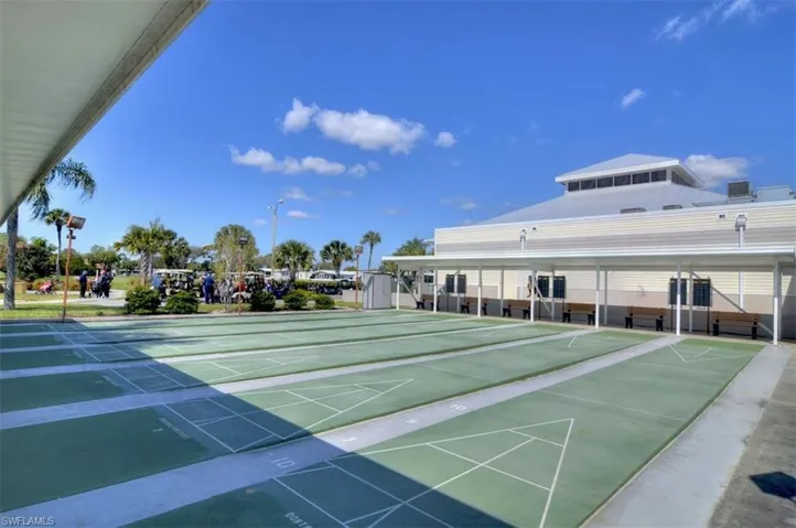 View of property's community with shuffleboard