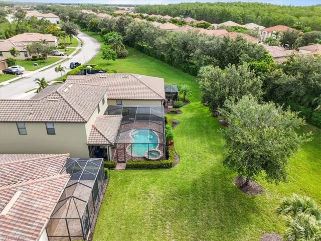 Aerial view of residential area featuring a pool