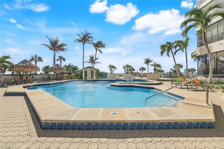View of swimming pool with a gazebo, a patio area, and a hot tub