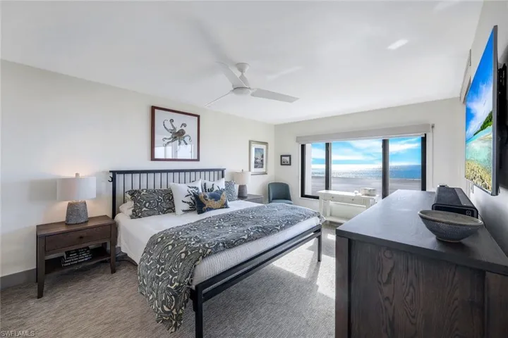Bedroom with carpet flooring and ceiling fan