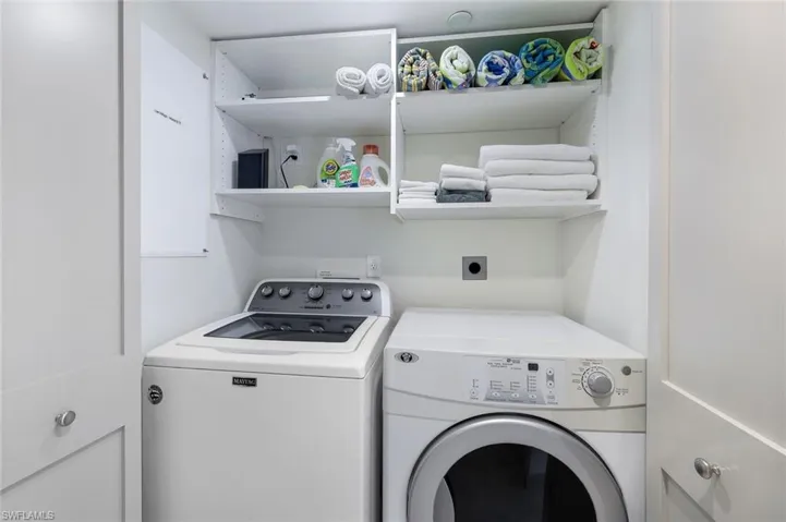 Laundry area featuring independent washer and dryer