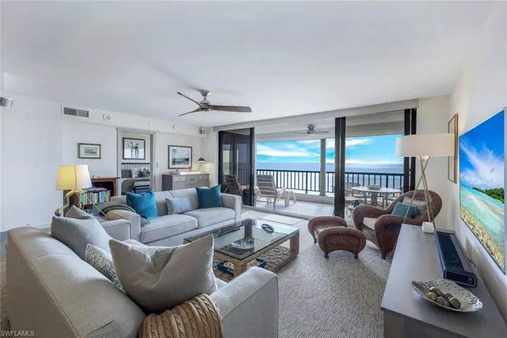Living room featuring ceiling fan