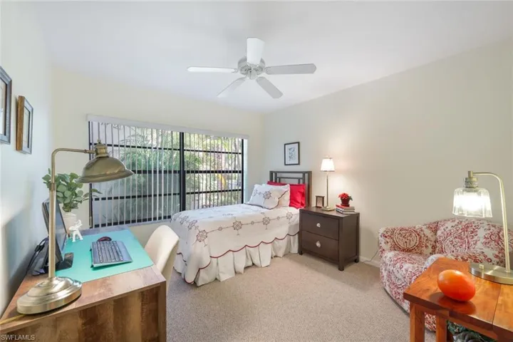 Guest-bedroom featuring light colored carpet and ceiling fan