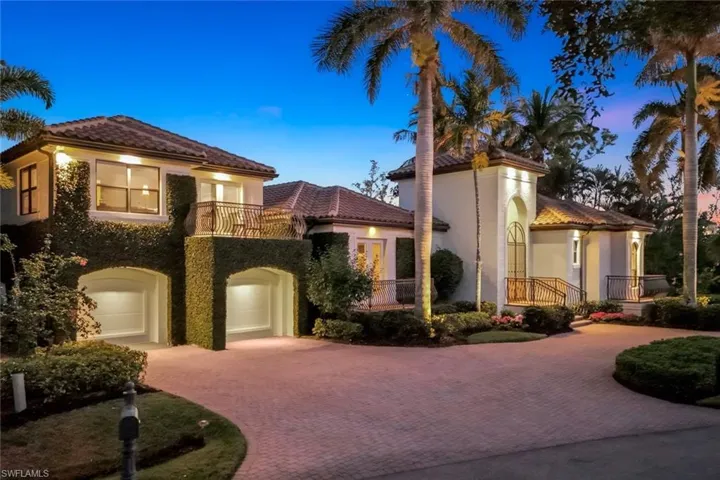 Large circle drive, landscape lighting and 3 car garage.