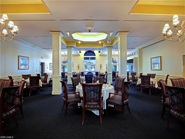 Club dining room with outdoor enclosed patio and bar.