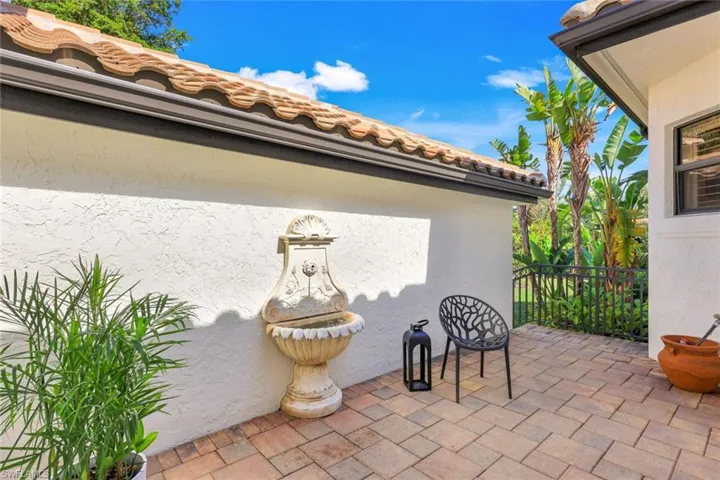Garden patio off dining room with fountain.