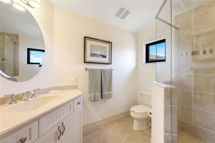 media suite bathroom with walk in shower.