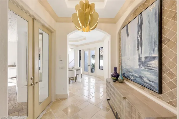 Grand entry foyer with designer lighting
