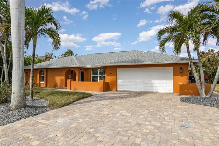Ranch-style home with a garage