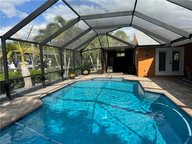 Prior to Hurricane  Helene  View of swimming pool featuring a patio area and a lanai