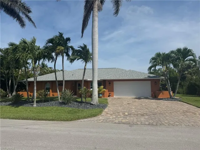 Prior to Hurricane  Helene  View of front of house featuring a garage