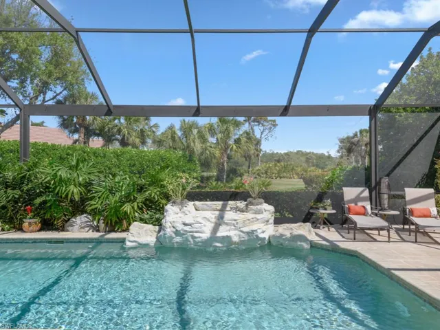 Pool with a patio area and a lanai