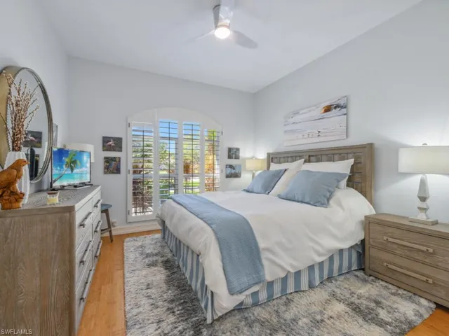 Bedroom with a ceiling fan and light wood finished floors