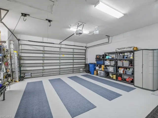 Garage featuring a garage door opener