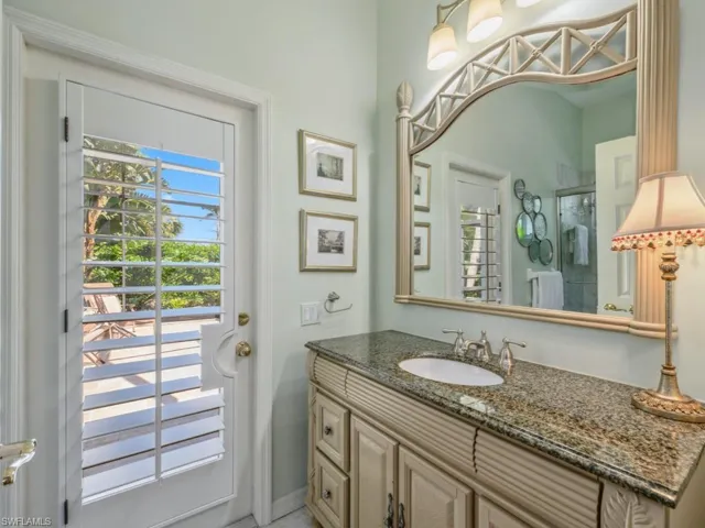 Bathroom with a shower stall and vanity