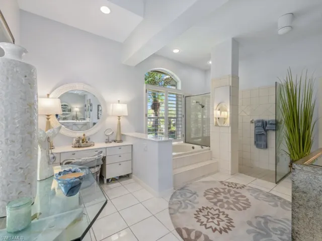Full bathroom featuring tile patterned floors, a garden tub, recessed lighting, and a walk in shower