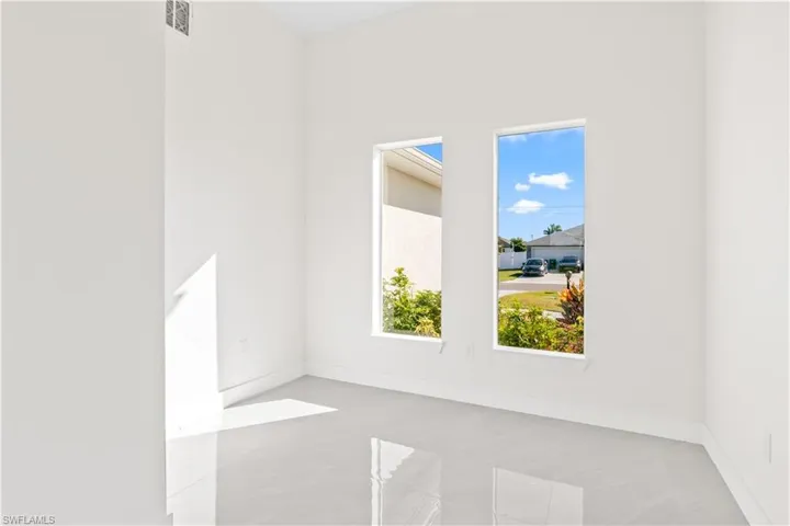 Unfurnished room featuring baseboards