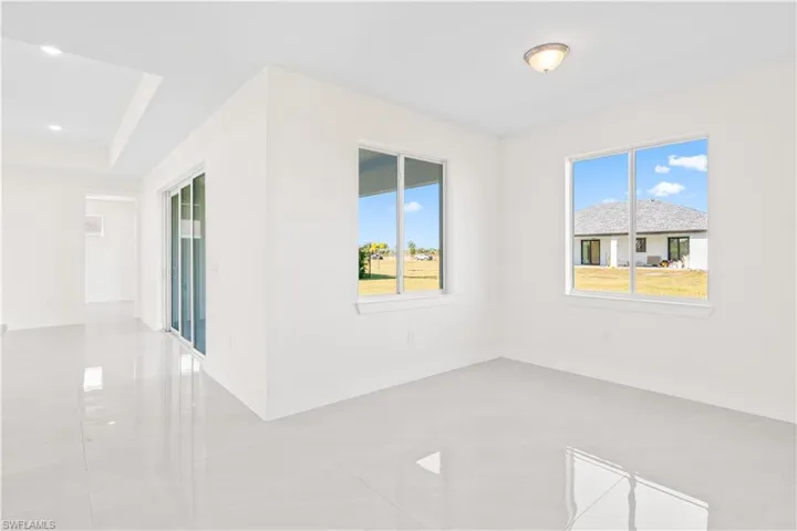 Empty room featuring baseboards