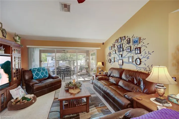 Living room with lofted ceiling
