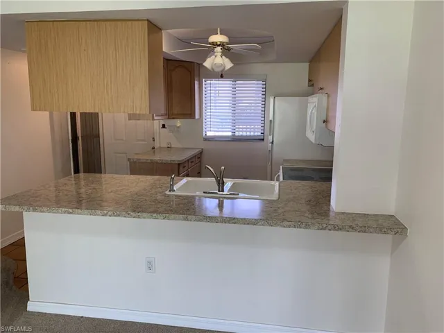 Kitchen with breakfast counter.