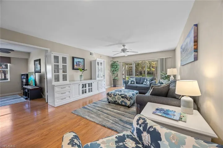 Living room with view to den/guest room and lanai