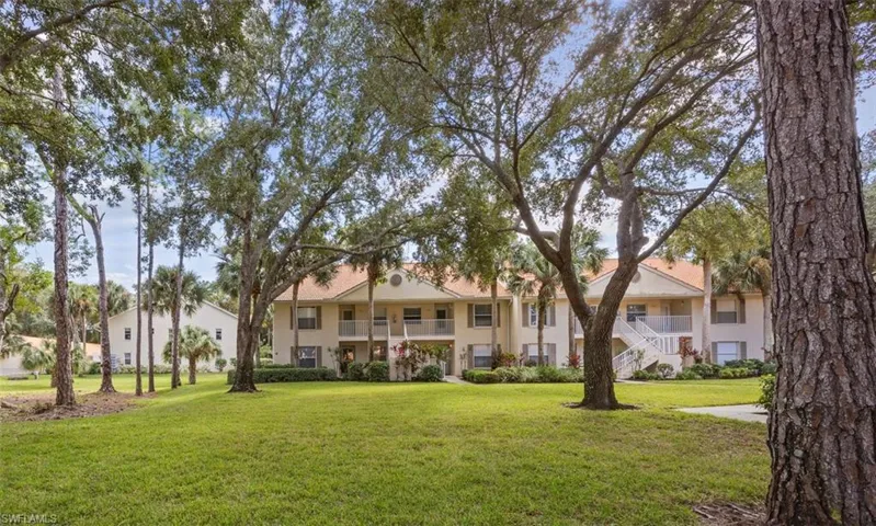 Wooded lawn in front of corner unit
