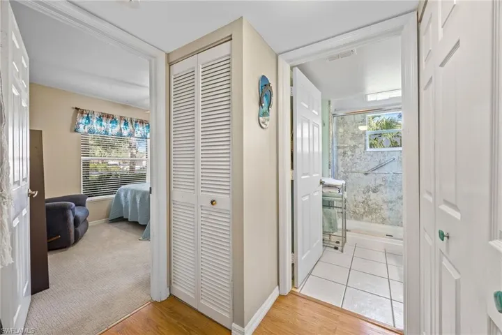 Hallway with view of guest bedroom/bathroom