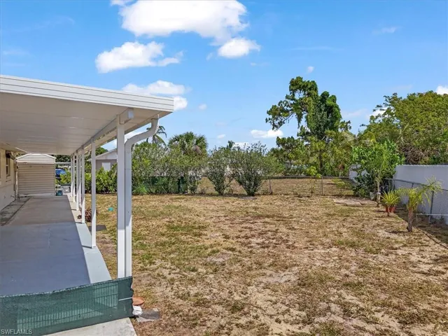 View of yard featuring fence
