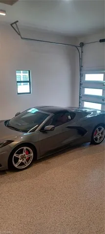 12 foot high ceiling will accomodate car lifts and the 8' high garage door will allow higher vehicle parking. Show-stopper epoxy flooring has extra flaking and slip resistance.
